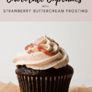 Chocolate Cupcakes with Strawberry buttercream on brown parchment paper.
