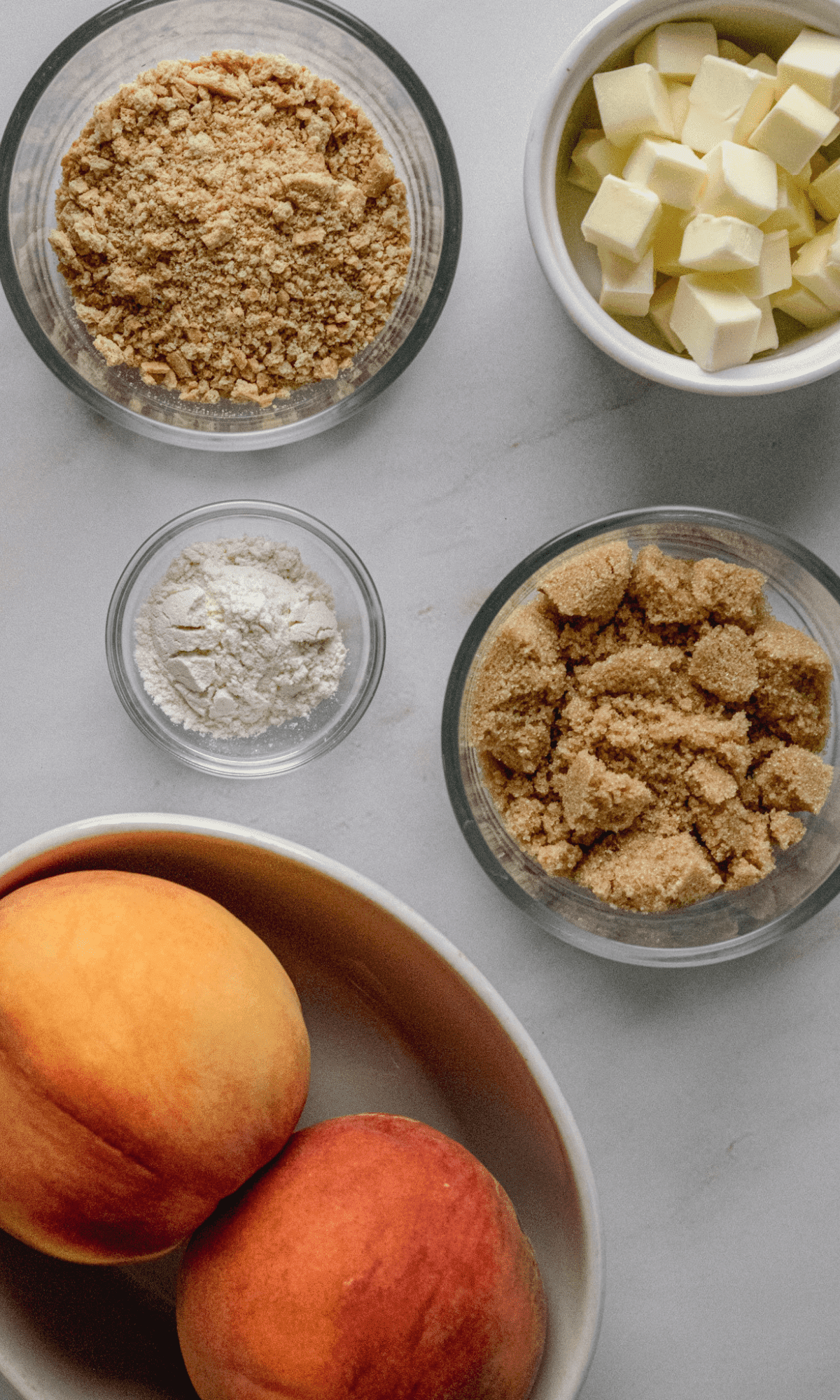 Overhead shot of ingredients for Individual Air Fryer Peach Crisps.