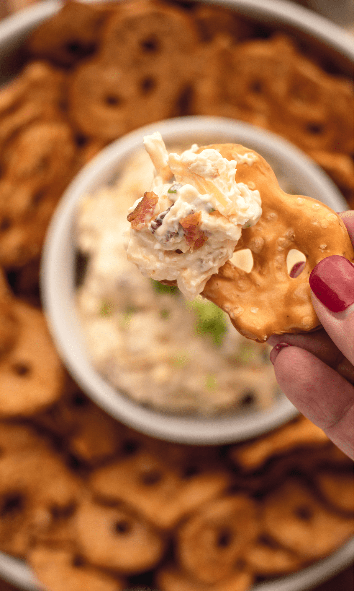 Close up of a pretzel crisp with Pretzel Dip on it.