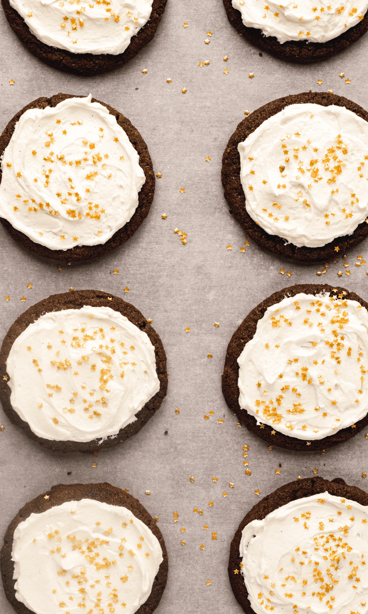 Overhead shot of Chocolate Cookies with Buttercream Frosting and gold sprinkles.