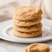 A stack of snickerdoodle cookies on a white plate.