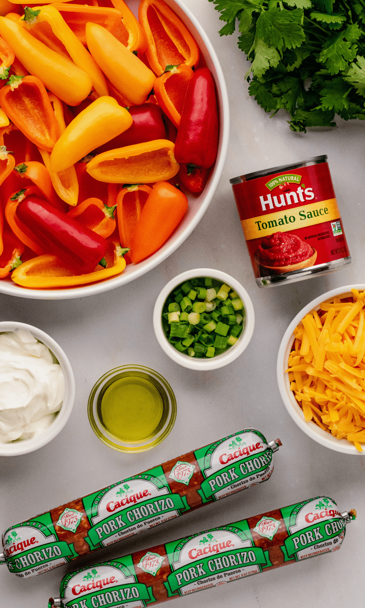 Overhead shot of mini bell pepper nachos with chorizo ingredients.
