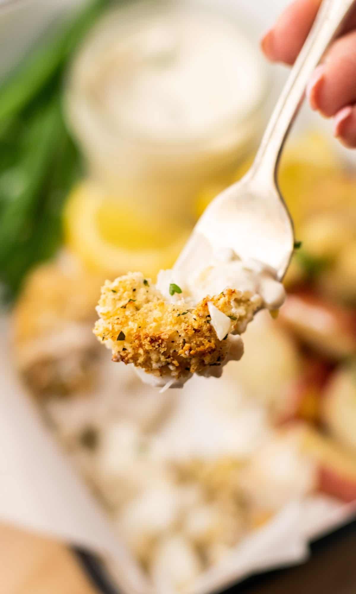 Crunchy Baked Cod with Parmesan Panko Breadcrumbs on a fork.