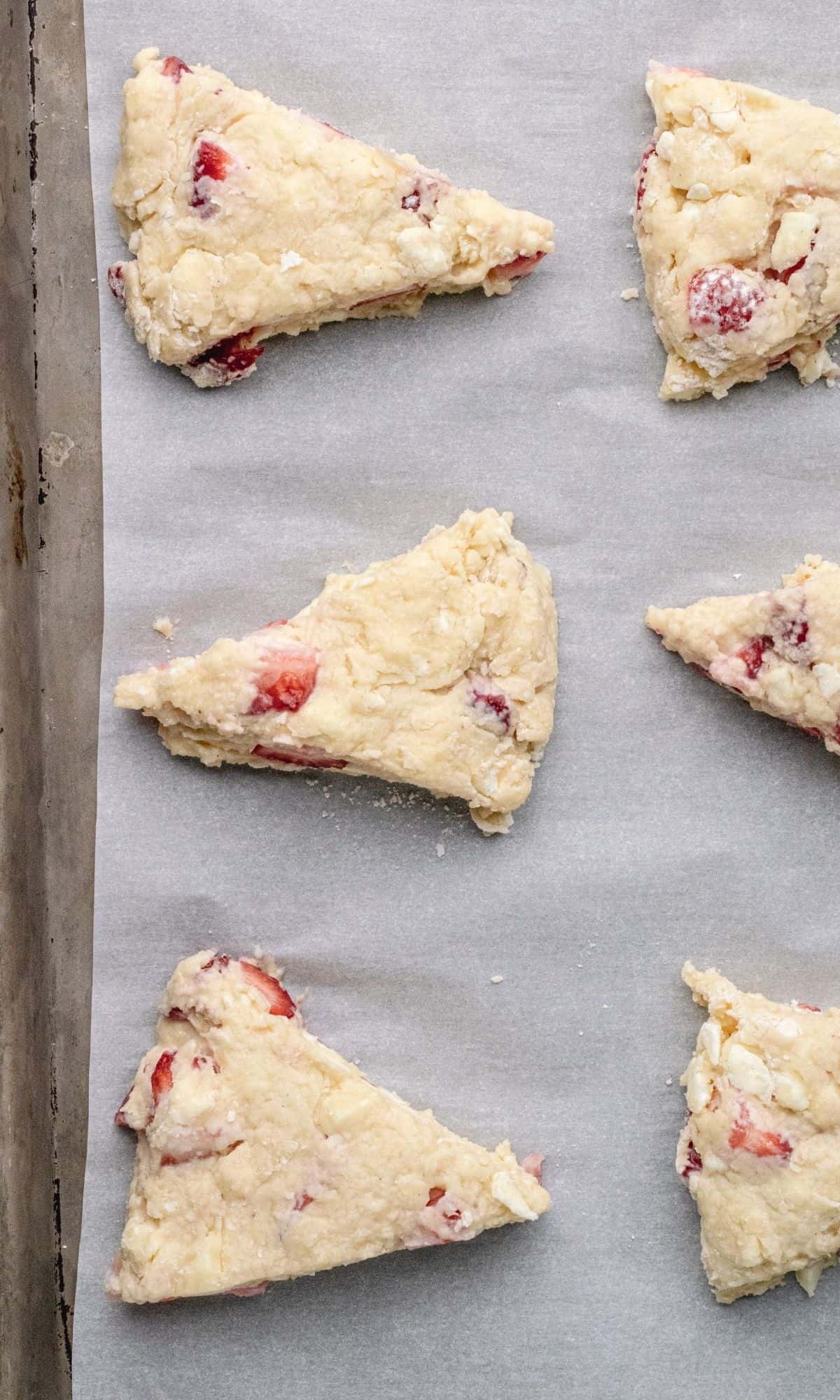 Strawberry buttermilk scones on baking sheet piror to baking.