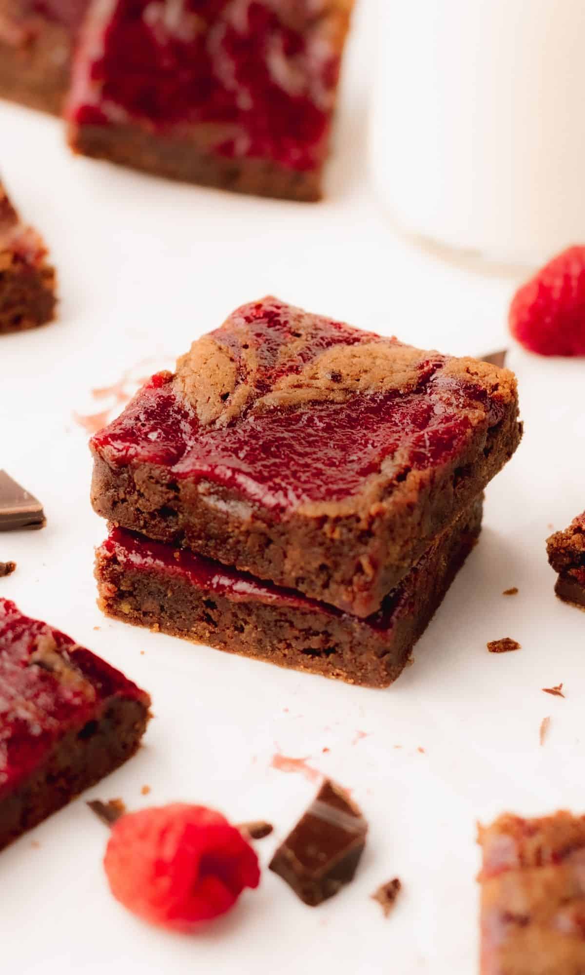 A stack of two chocolate raspberry brownies.
