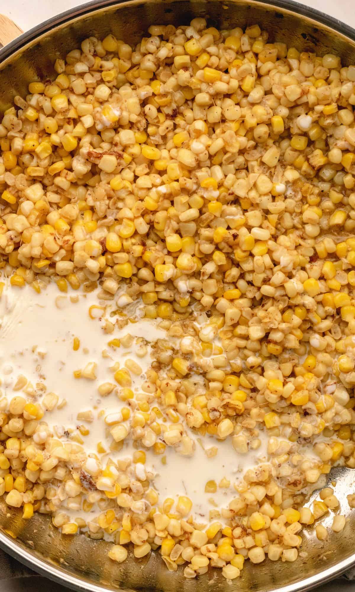 Creamy skillet corn preparation in a skillet.