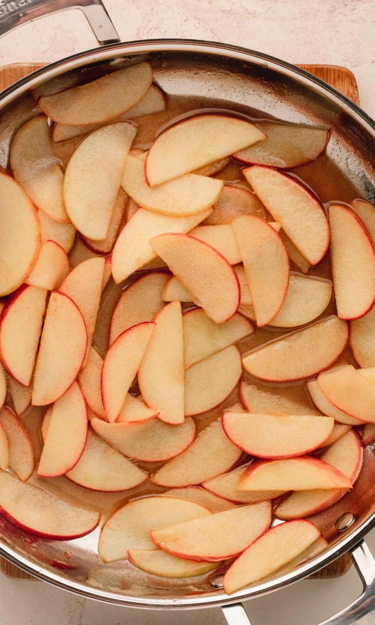 Apples in a large frying pan.