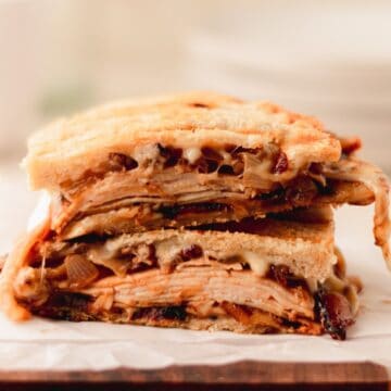 A stack of roasted apple anc chicken panini halves.