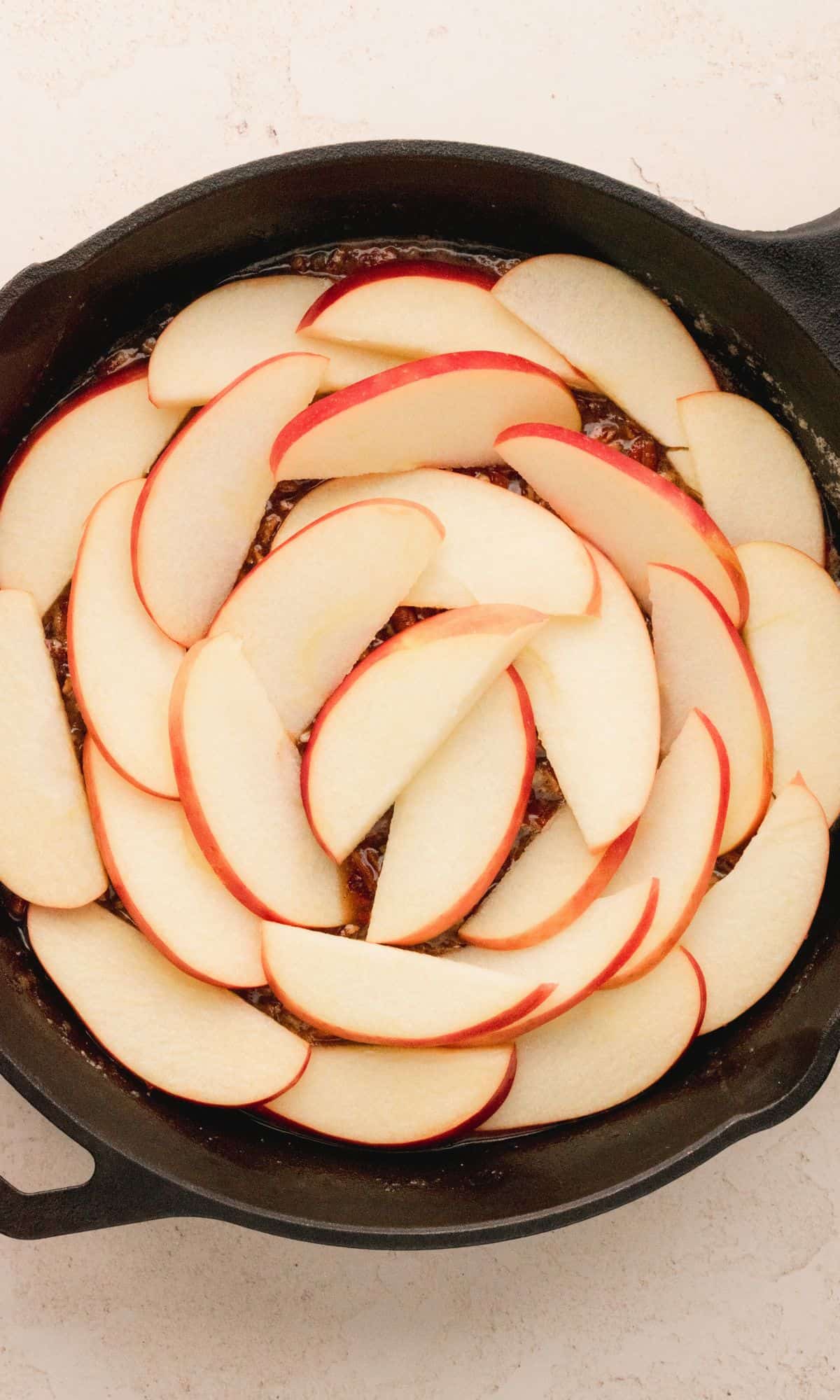 Caramel pecan apple spice upside down cake preparation.