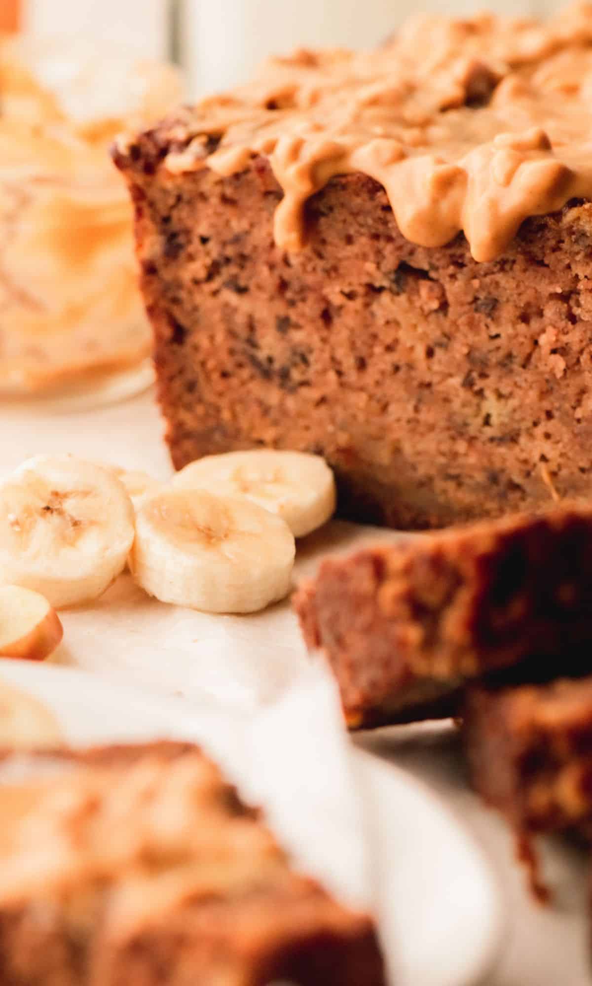 Apple banana bread topped with peanut butter.