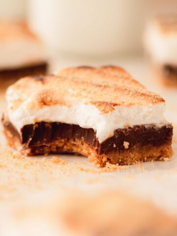 A s'mores bar with a bite take out of it.