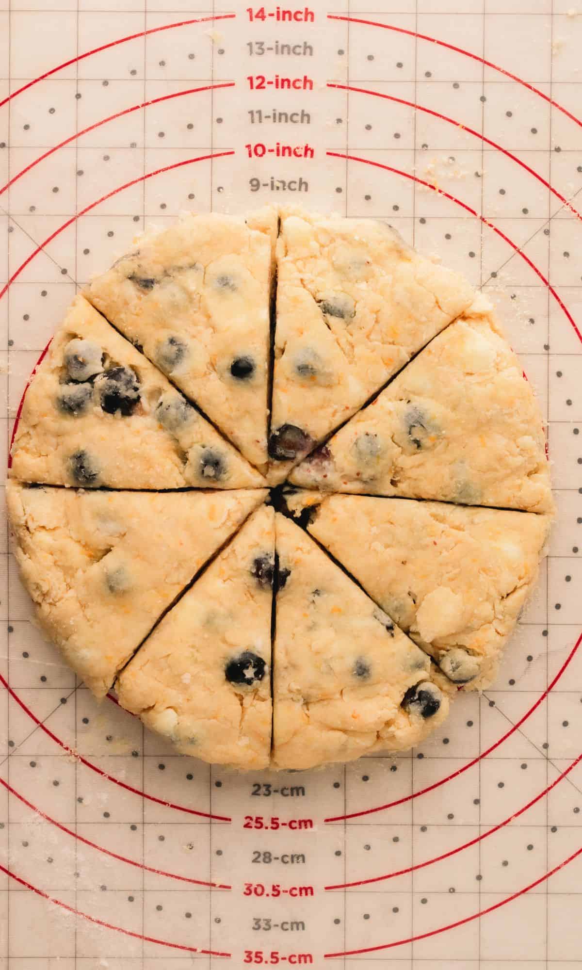 Blueberry scone dough after cutting into wedges.