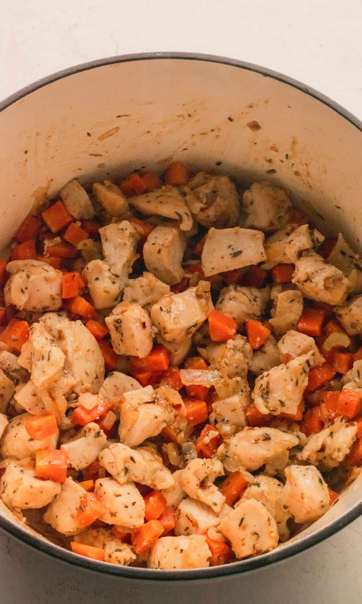 Chicken orzo soup preparation.