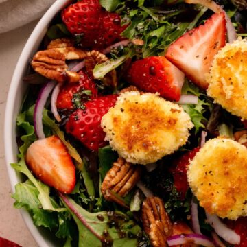 An overhead shot of a salad in a white bowl.