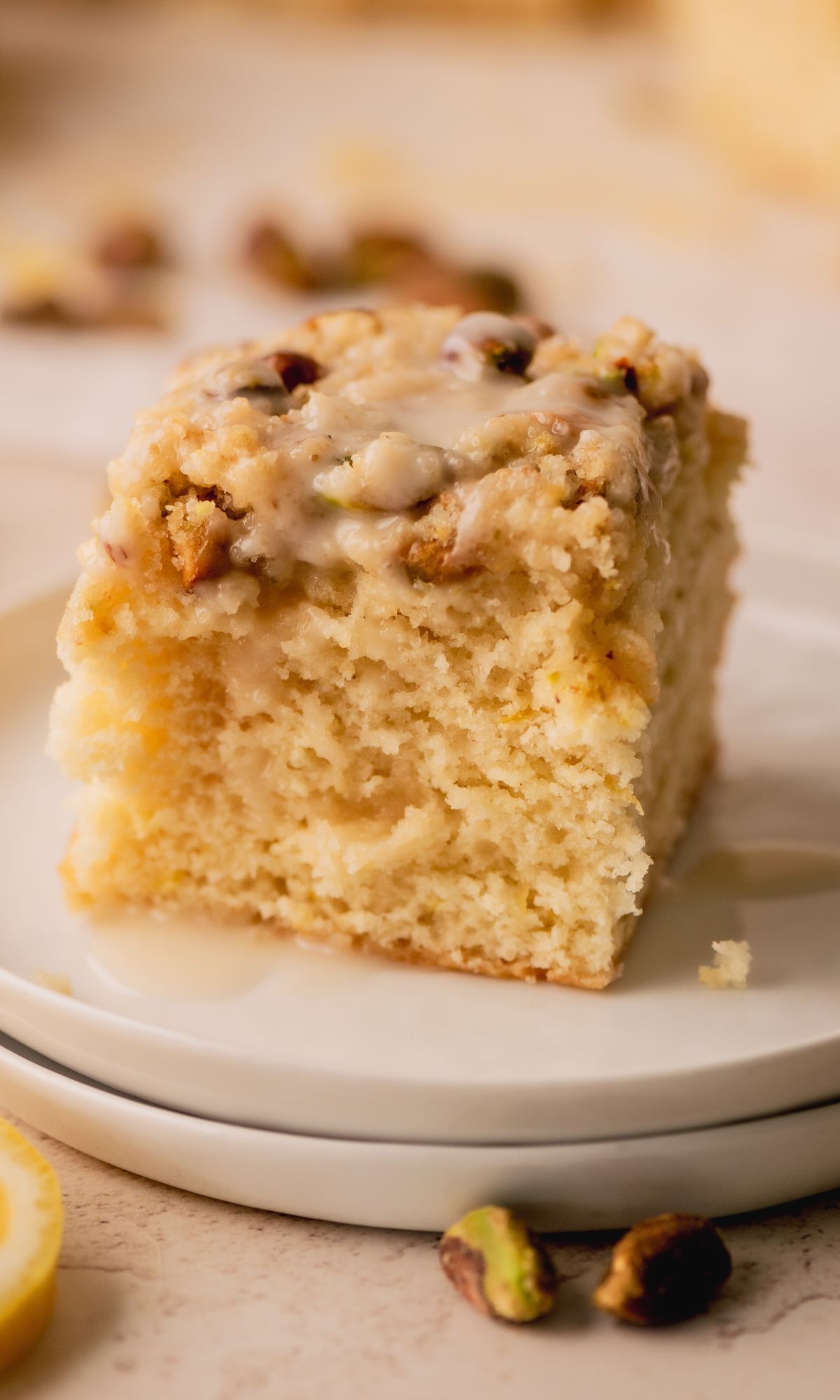 A slice of cake on a white plate.