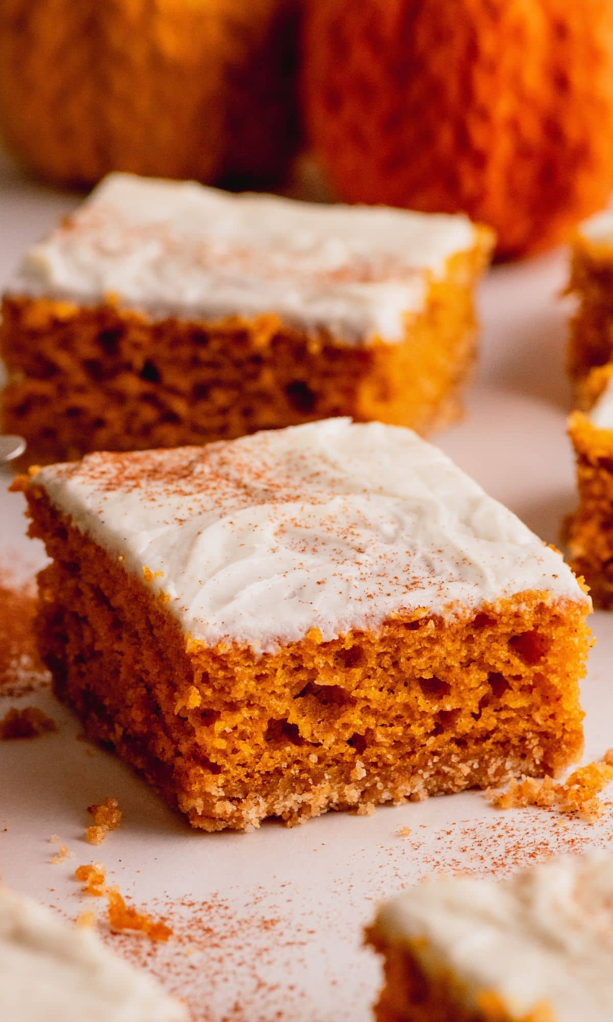 Pumpkin bars with cream cheese frosting and graham cracker crust.
