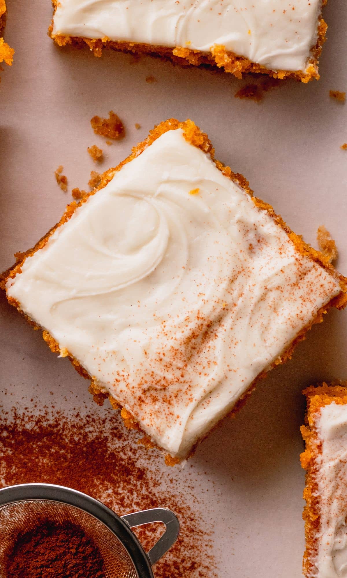 Pumpkin bars with cream cheese frosting and graham cracker crust.