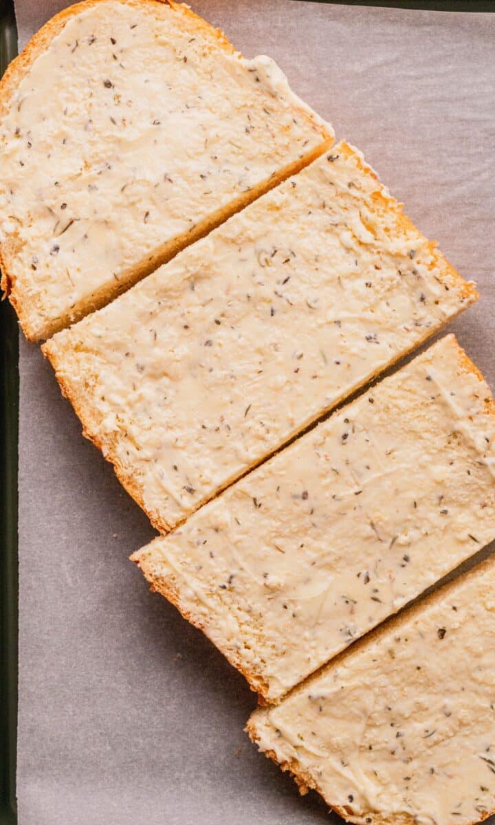 Buttered bread topped sliced into pieces.