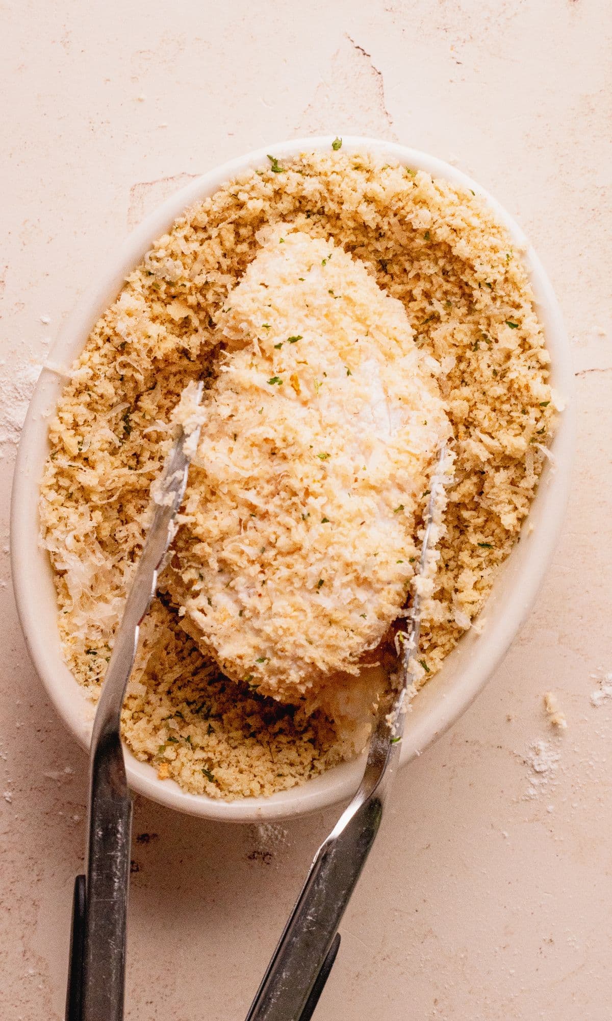 Cod filet dredged in panko breadcrumbs.