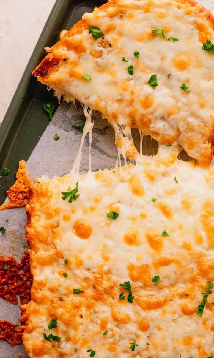 Cheese bread getting pulled apart.