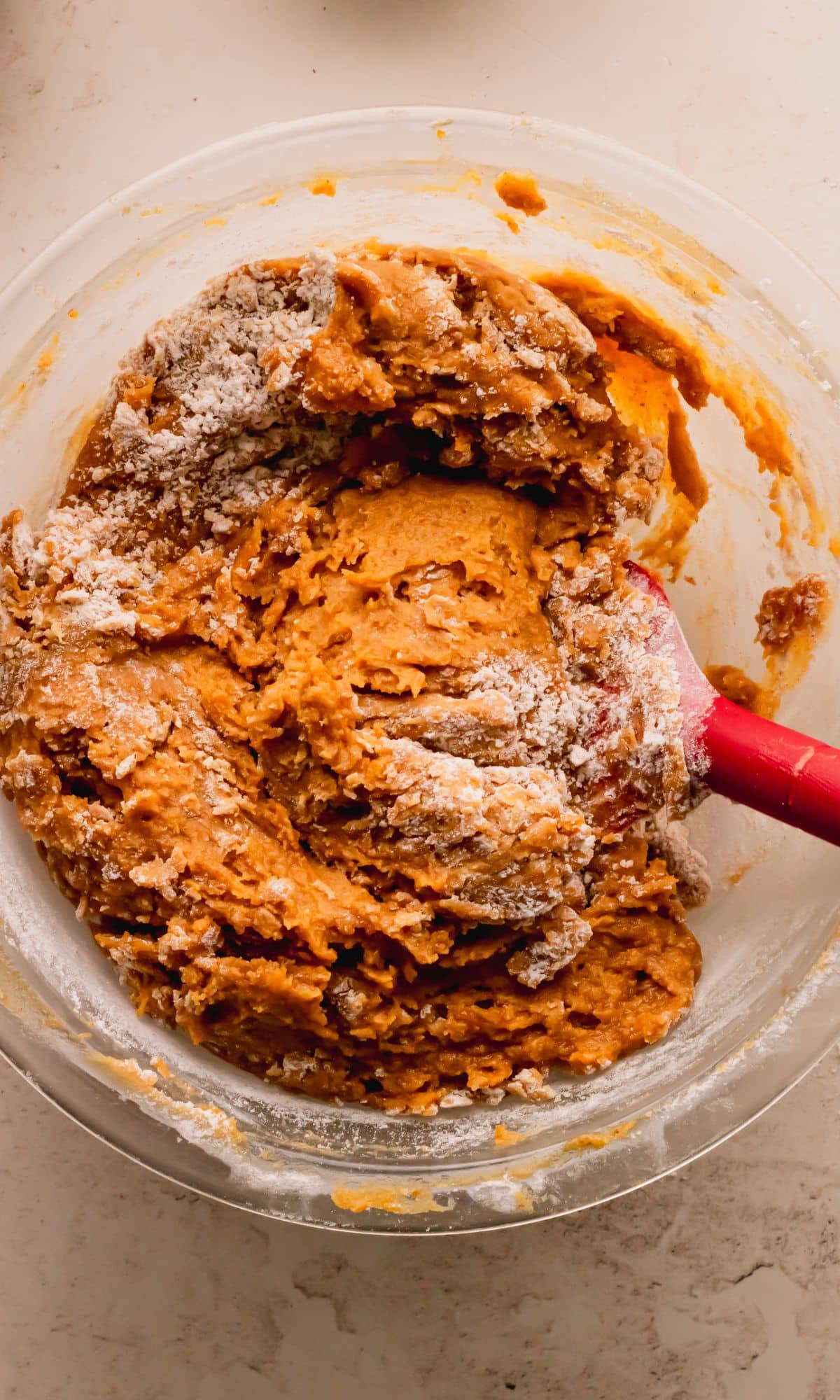 Mixing wet and dry ingredients for pumpkin blondies.