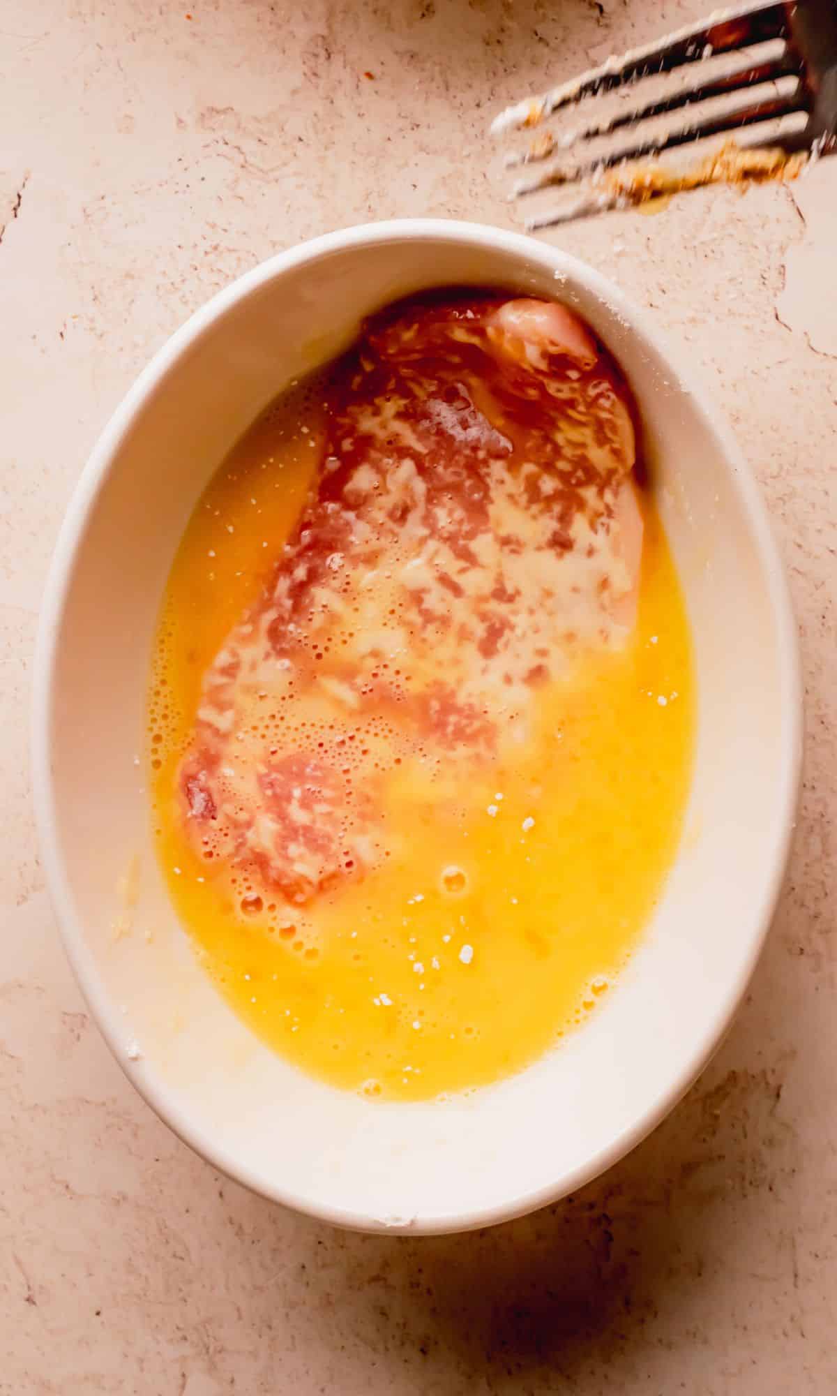 A pork chop dredged in egg.