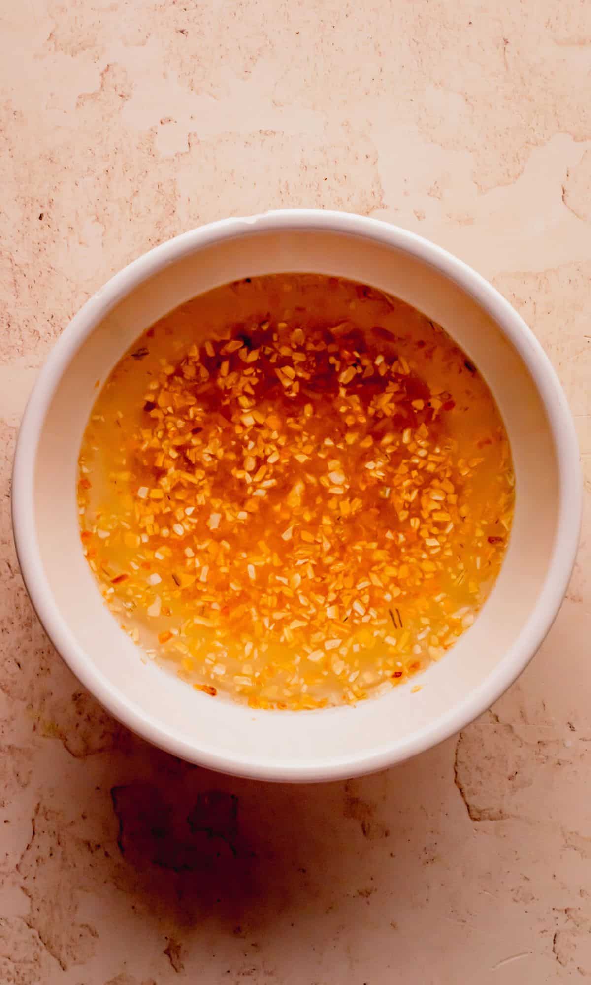 Rehydrating dehydrated onions in water.