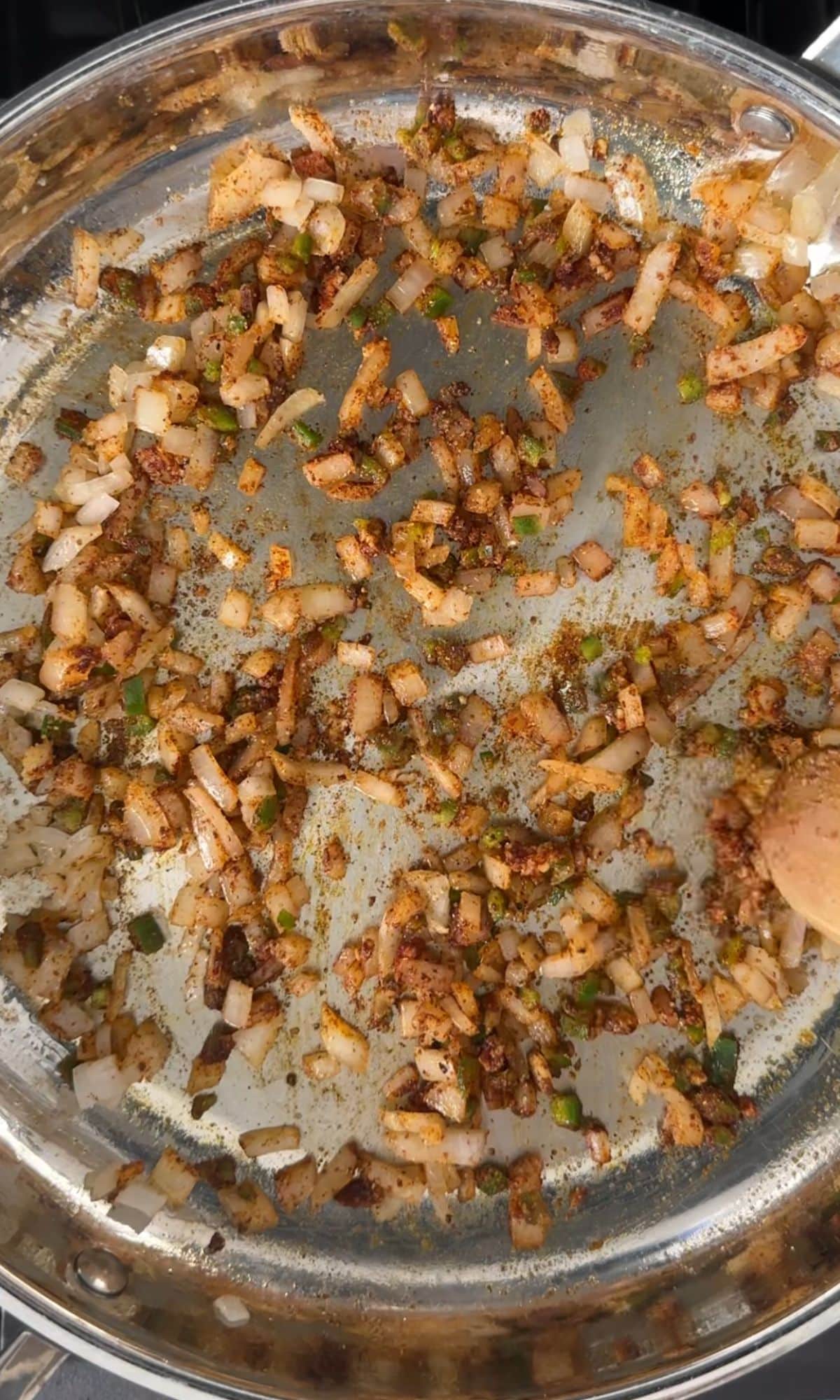 Onions with seasonings in skillet.