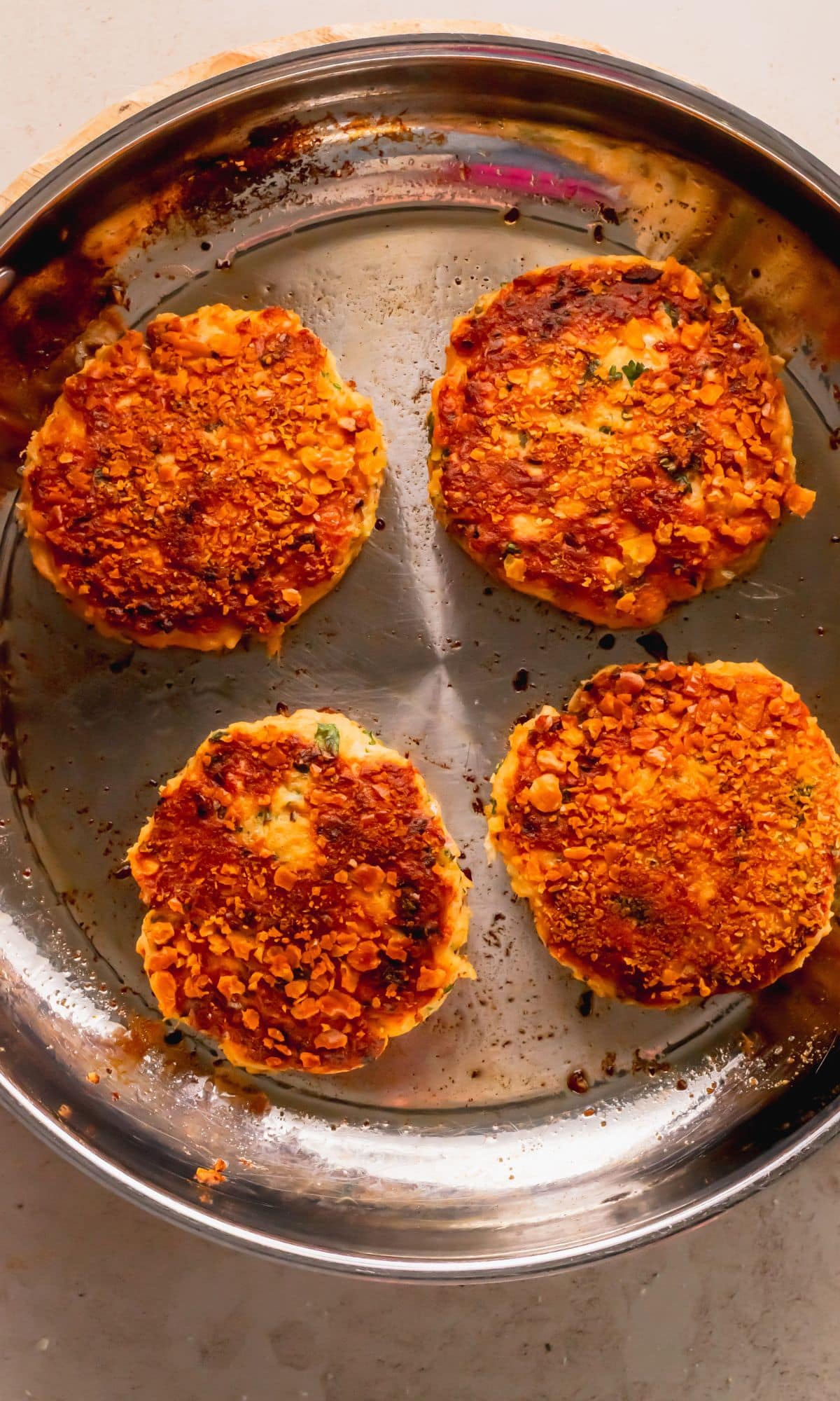 Salmon cakes in the pan.