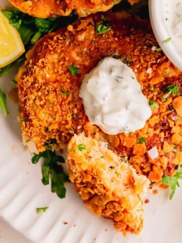 A piece of a salmon cake turned on it's side.