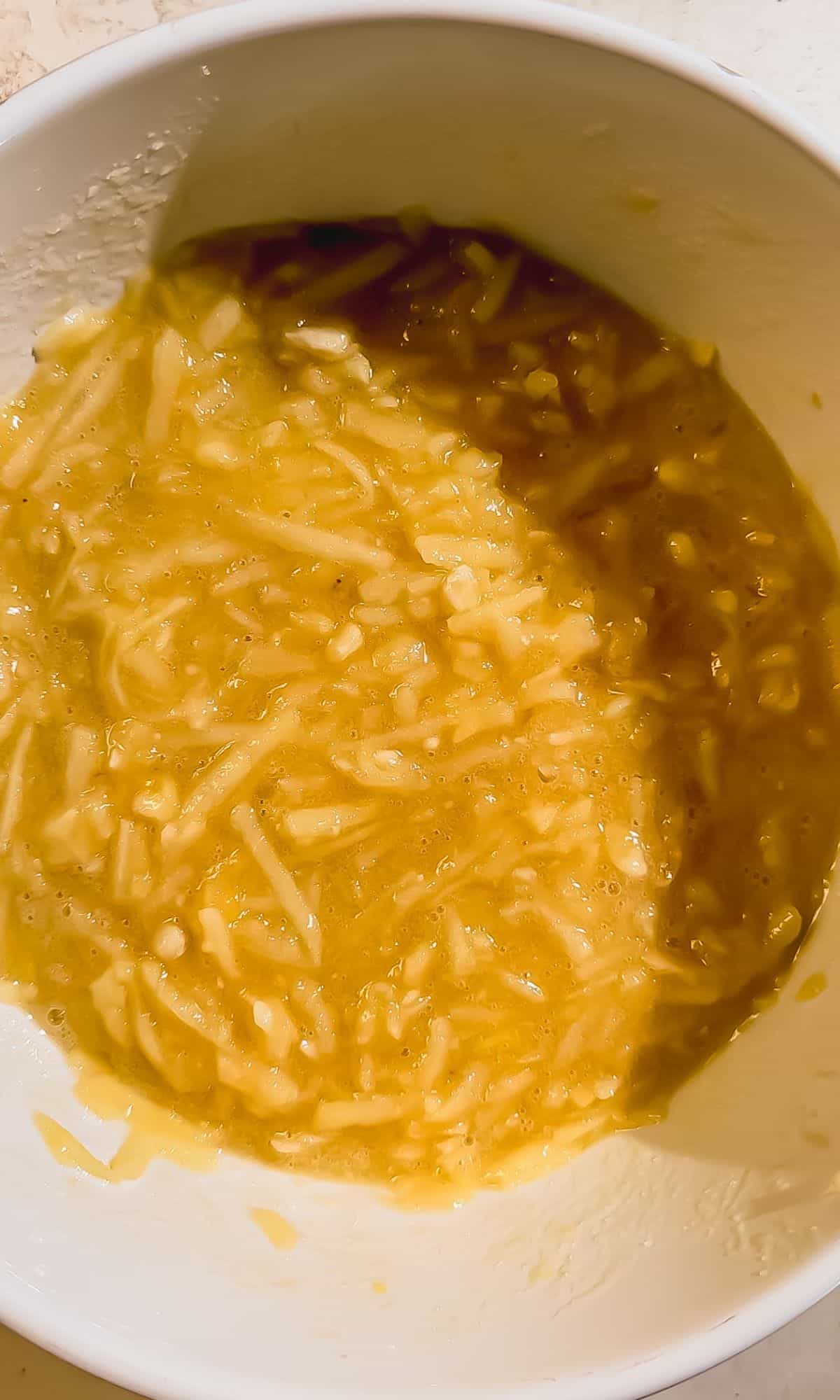 Apple banana bread ingredients in a bowl.