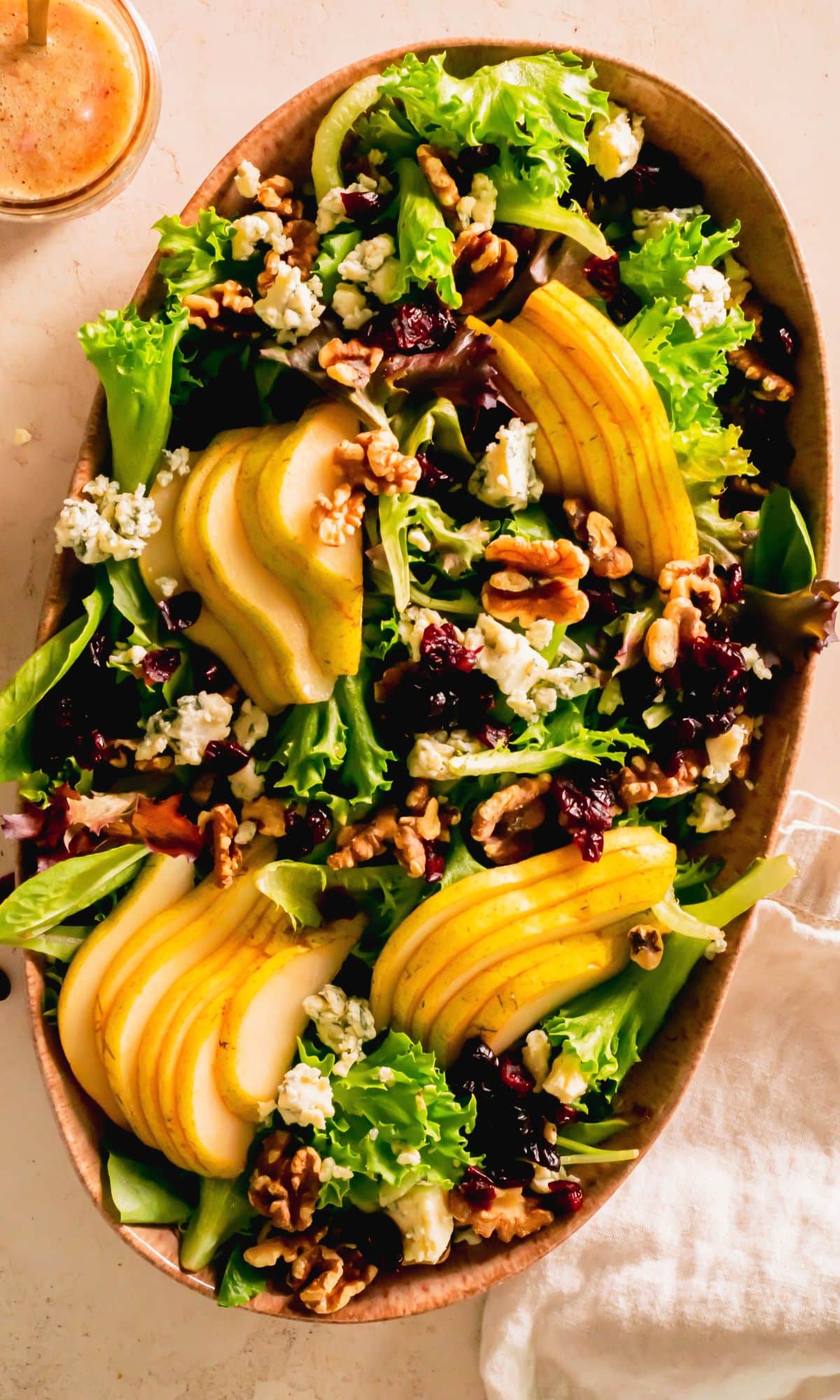 Pear blue cheese salad arranged on a serving platter.