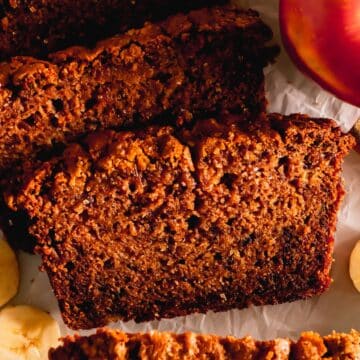 A cut piece of apple banana bread.