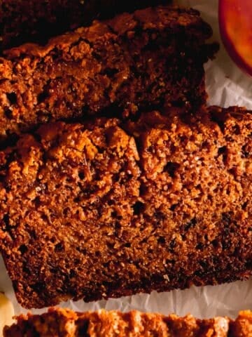 A cut piece of apple banana bread.