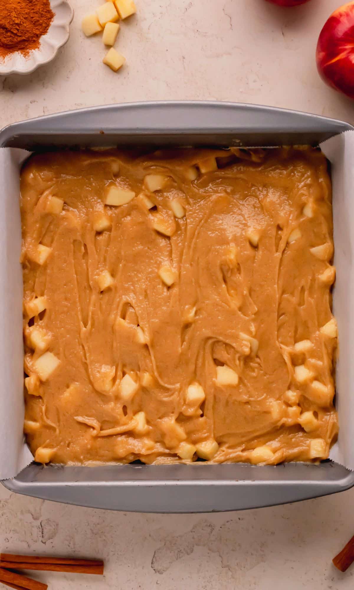 Apple cinnamon blondies in pan before baking.