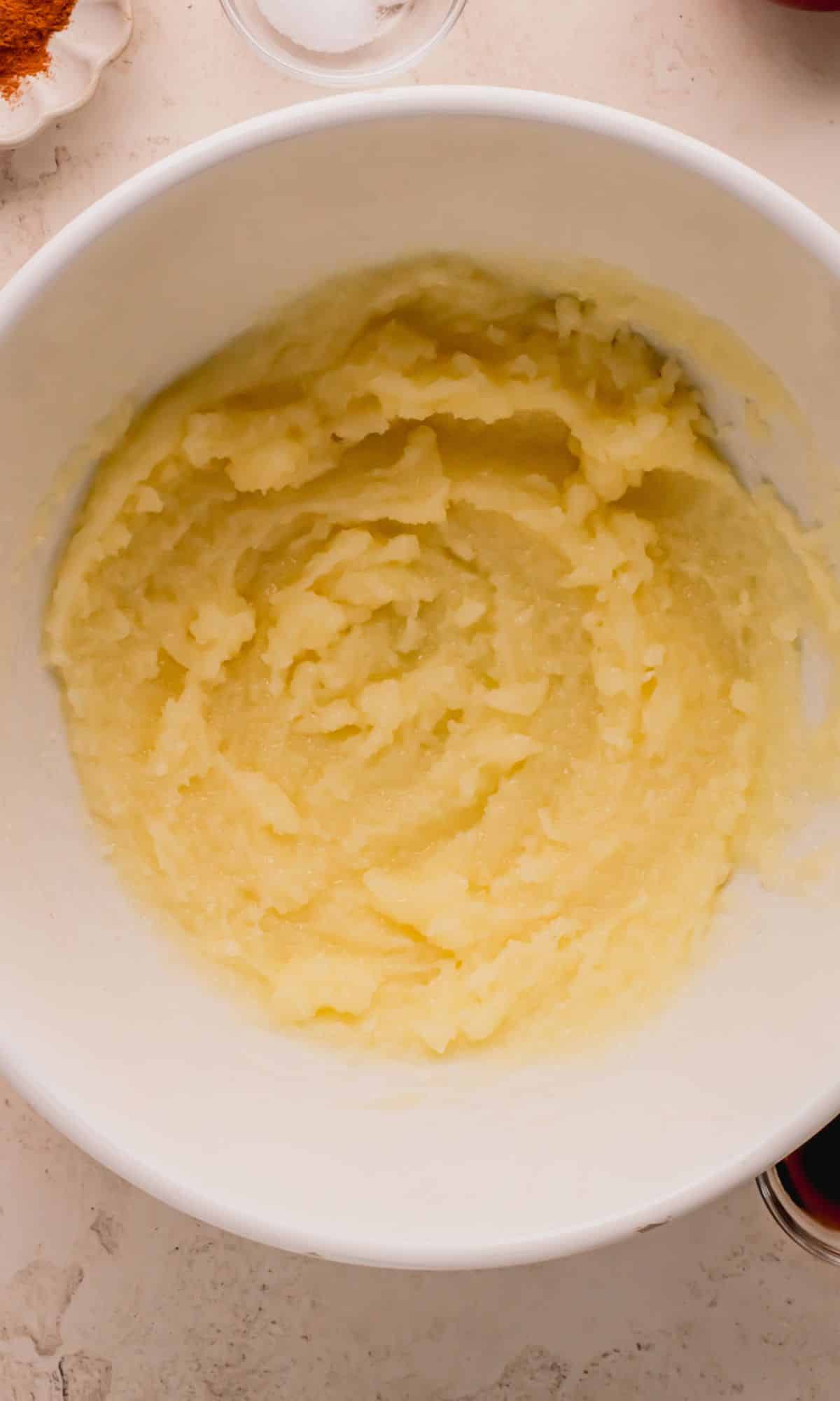 Butter and sugar mixed in a bowl.